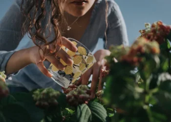 A girl watering the plants in the garden