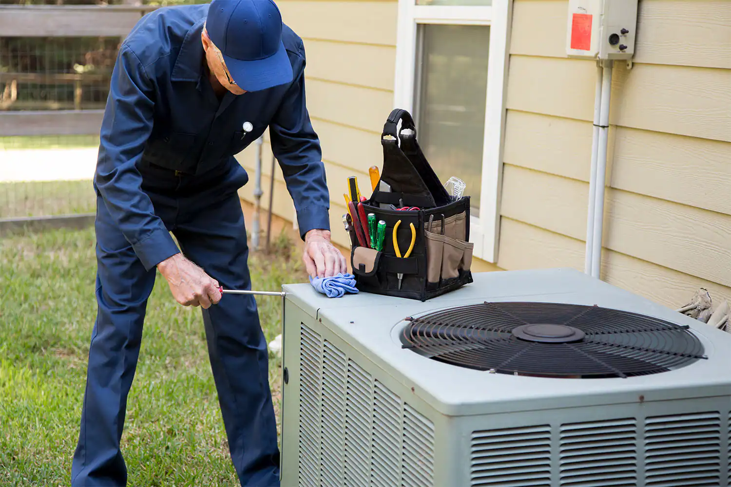 HVAC Inspections getting performed by a service man