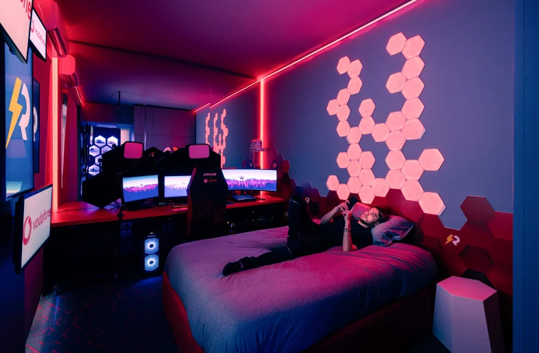 guy sleeping on bed in gaming room