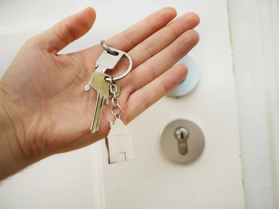 holding keys in hand - Buying a House
