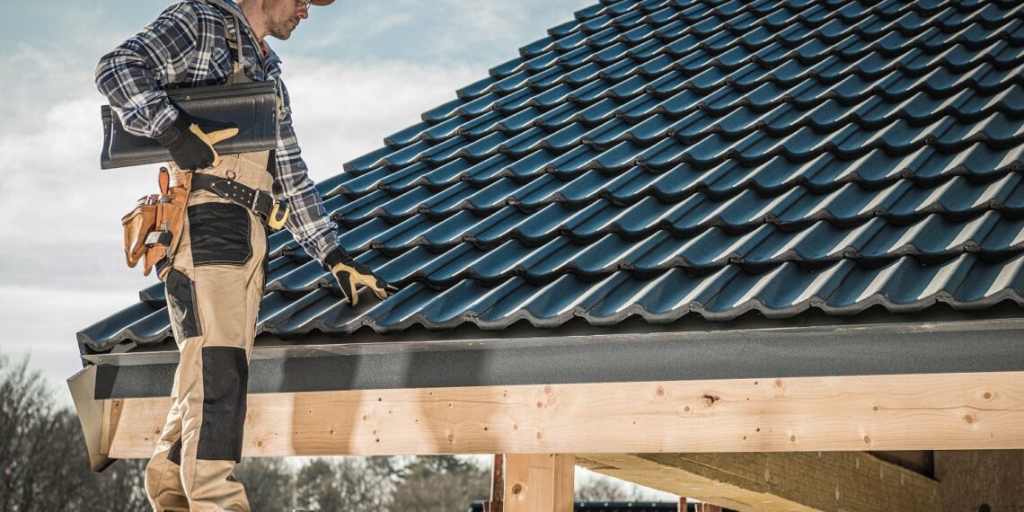 A roofing contractor inspecting the roof