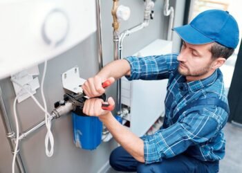 plumbers fixing the water pipe.