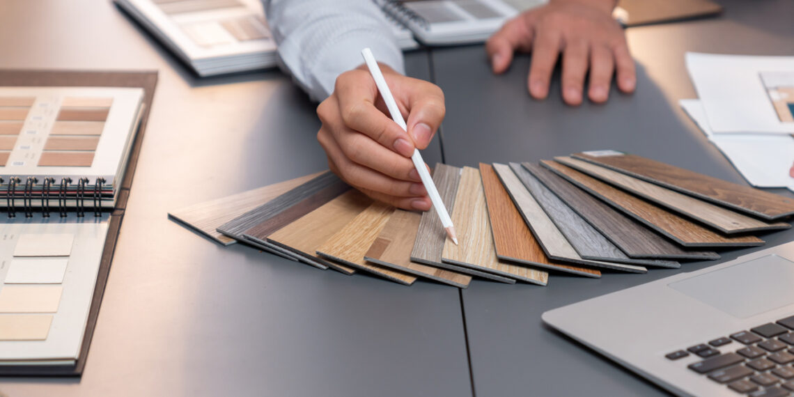 Group of interior designer team in meeting and discussing about tile flooring