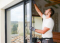 Man cleaning the window- Energy-Efficient Window