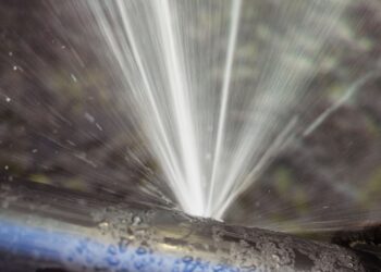 Water leaks from a water pipe indicating water wastage