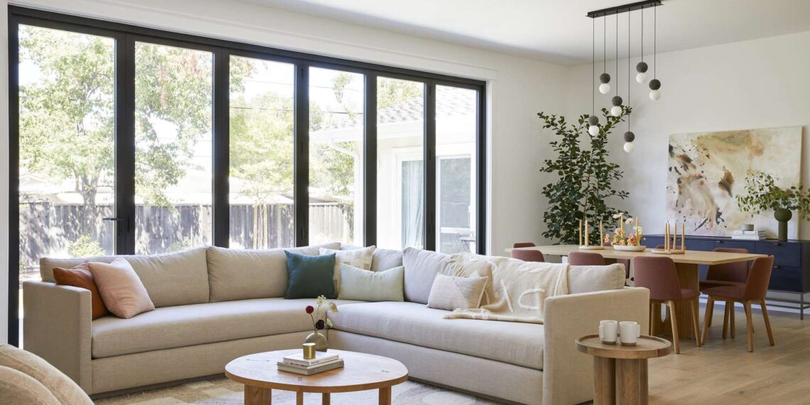 A Living Room with life size window and furniture