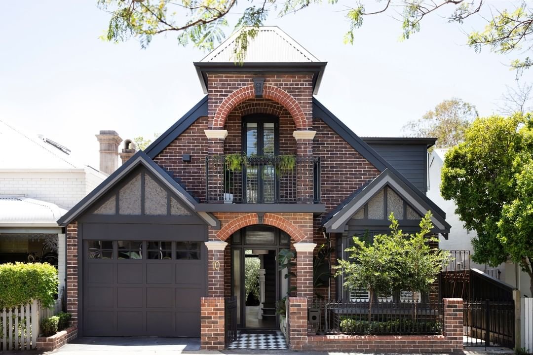 Black trim color with red brick house