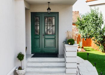 A white house with green colored front door