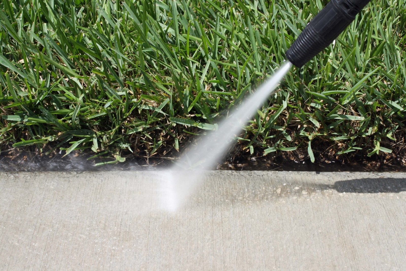 Regular cleaning for concrete and grass driveway