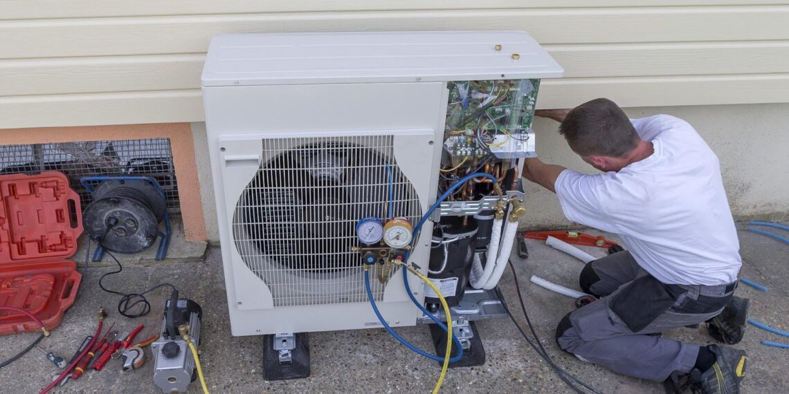 A man repairing Heat Pump