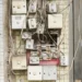 several assorted power switches mounted on white wall - Circuit Breaker
